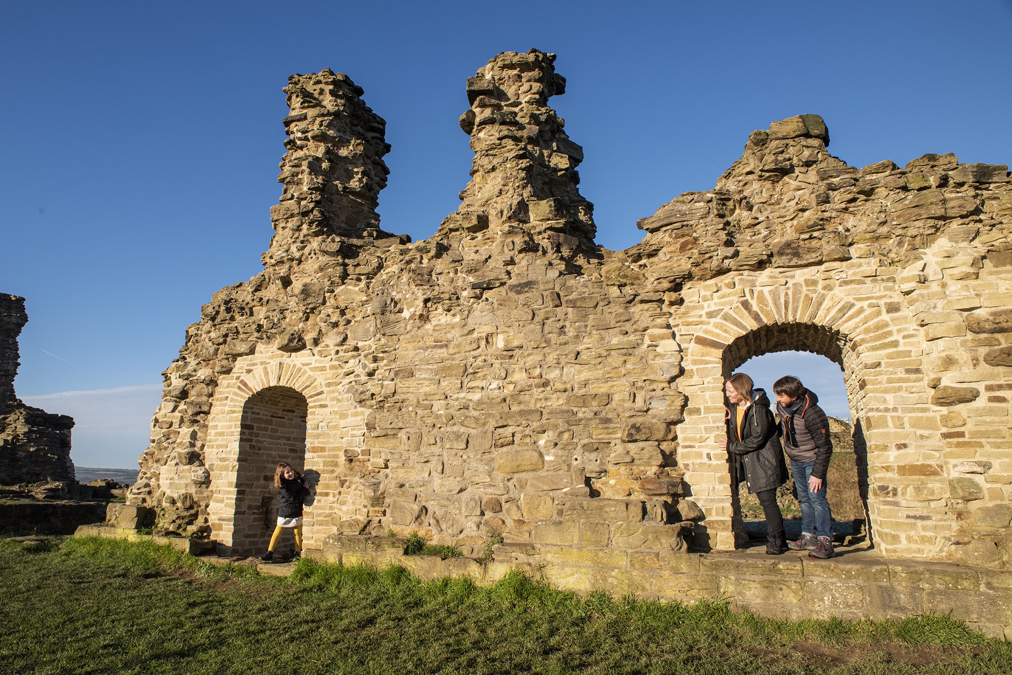 Sandal Castle remains with people